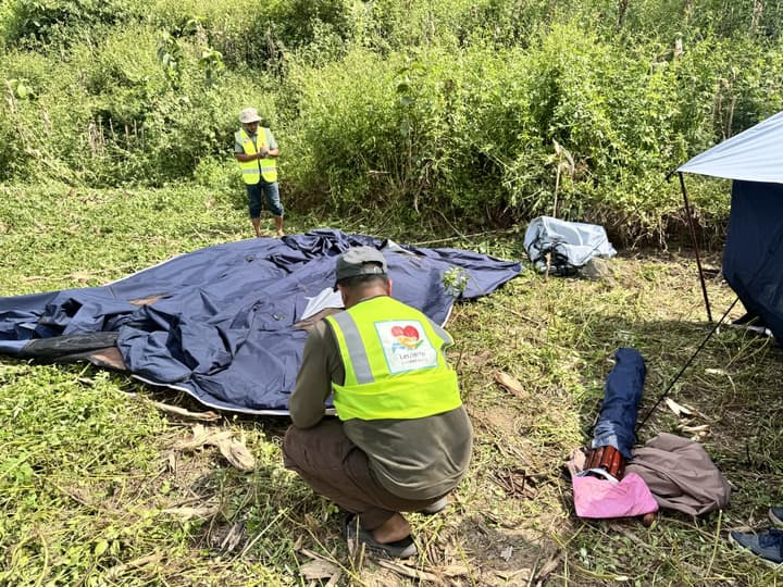 Spreading out the tent canvas