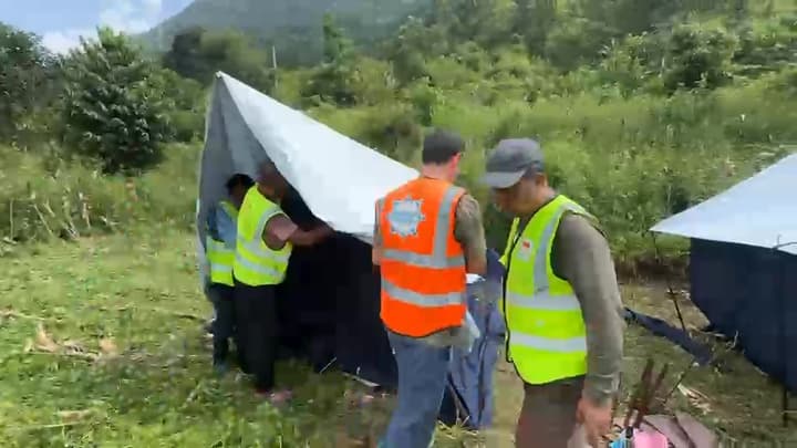 Raising a tent together