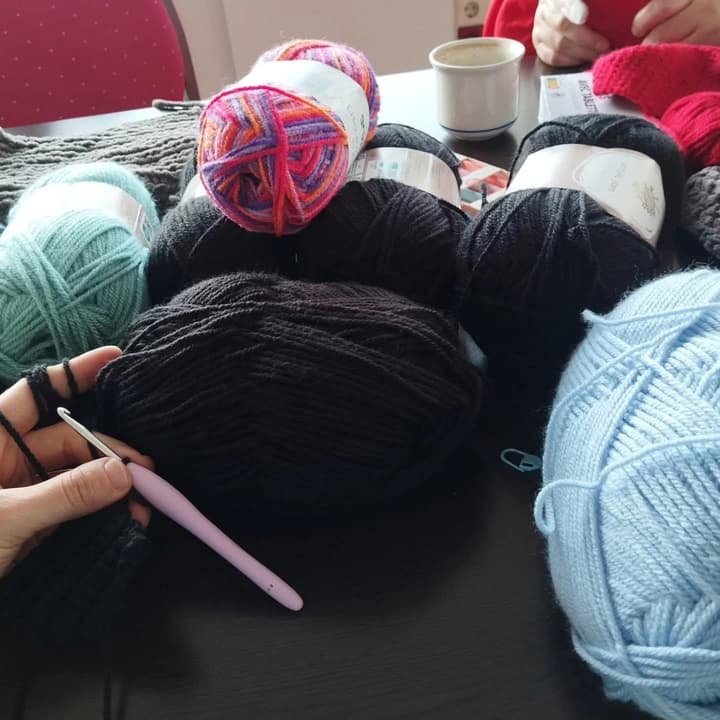 Balls of wool and a crochet hook
